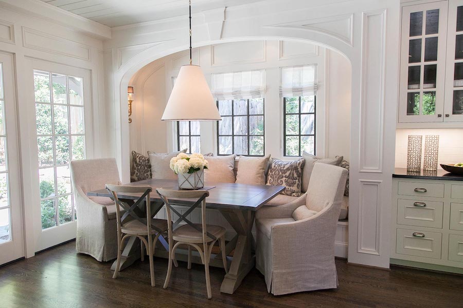 brookhaven tudor breakfast nook with arching millwork and custom bench