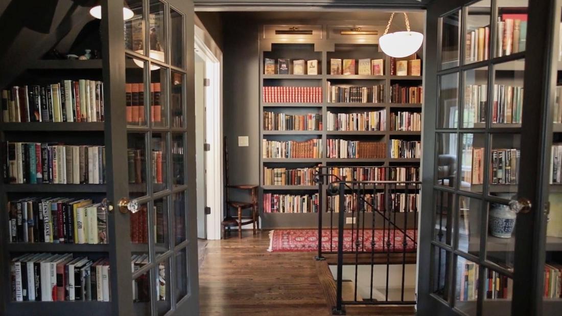brookhaven tudor upstairs landing and library with custom booksheleves