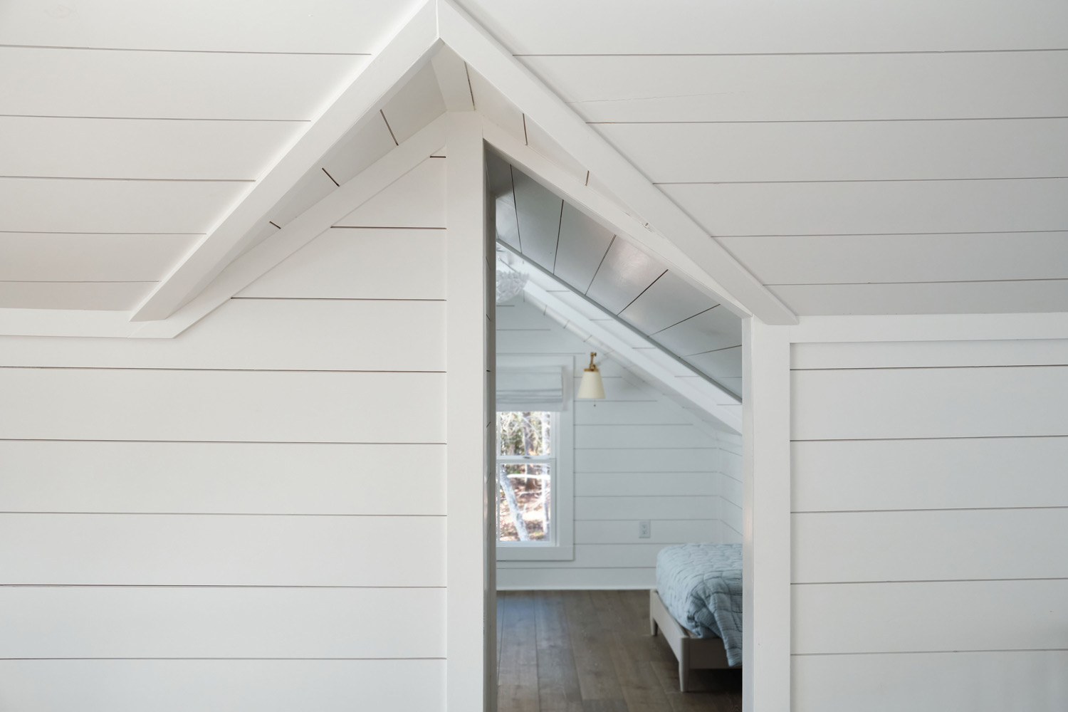an architectural viewpoint of the upstairs loft with shiplap siding
