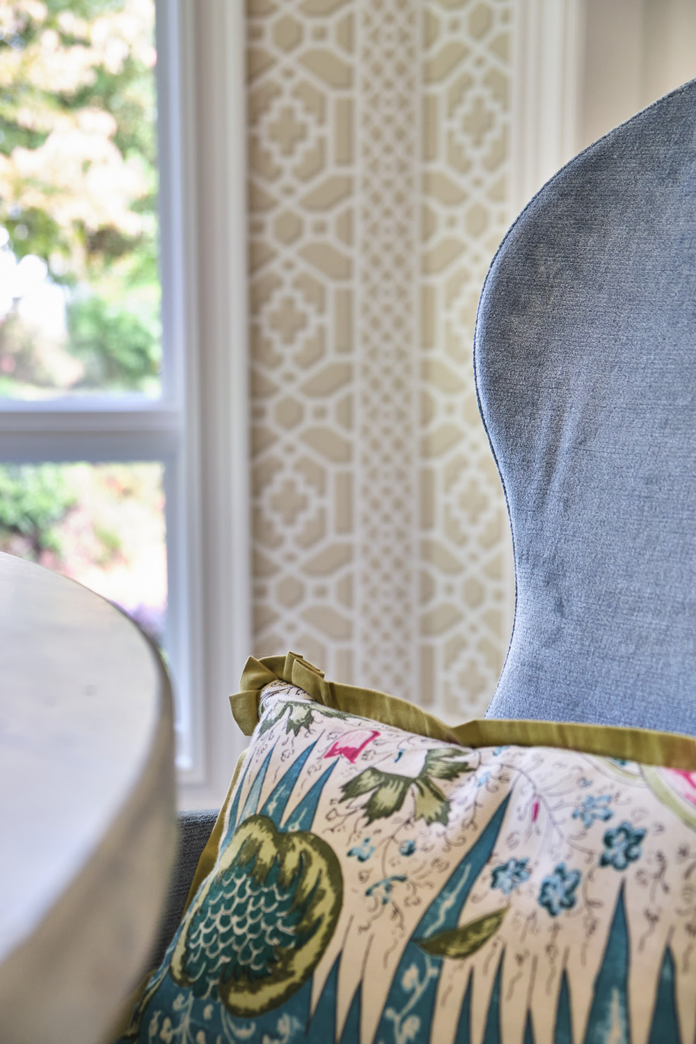 detail of the blue chairs and pillows in the breakfast area