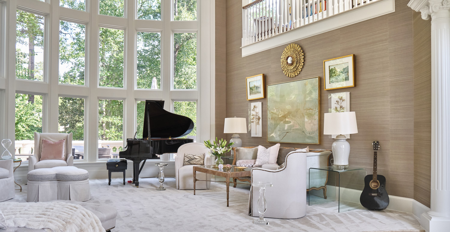 the living room seating area connected to the open second floor above